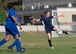 HMS soccer players kicks the ball