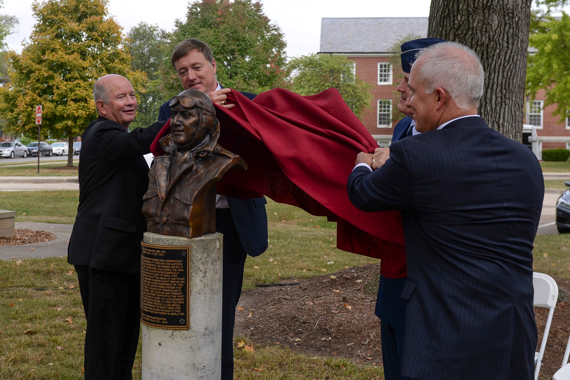 Guest speakers for Sir Alan Cobham's Air Mobility Command Walk of Fame induction ceremony unveil his memorial, Oct. 5, 2017, at Scott Air Force Base, Ill.