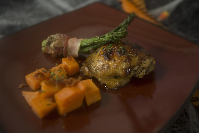 “Harriet Square Pants Sweet Roasted Chicken,” prepared by Lance Cpl. Cynthia JaretziCruz, a food service specialist with Headquarters Battalion, Marine Corps Base Hawaii (MCBH), and the winner of the “Chef of the Year” competition, is displayed at Anderson Hall, MCBH, Oct. 4, 2017. The competition pitted each winner or runner-up of the “Chef of the Quarter” cook-off against each other in a series of evaluations including a written test, display/presentation, and creativity. (U.S. Marine Corps photo by Lance Cpl. Luke Kuennen)