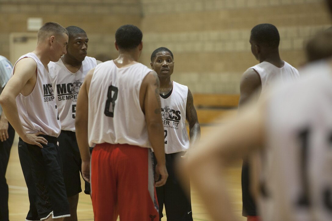 Maurice Givens, the Raiders’ coach, motivates his players during a half time pep talk during the 2017 USAA Commanding General’s Cup basketball tournament championship game at Paige Fieldhouse on Camp Pendleton, Calif., Sept. 28, 2017.  1st Marine Raider Support Battalion, U.S. Marine Corps Forces, Special Operations Command played against Assault Amphibian School Battalion in the championship game, losing 84-74.  (U.S. Marine Corps photo by Cpl. Bryann K. Whitley)
