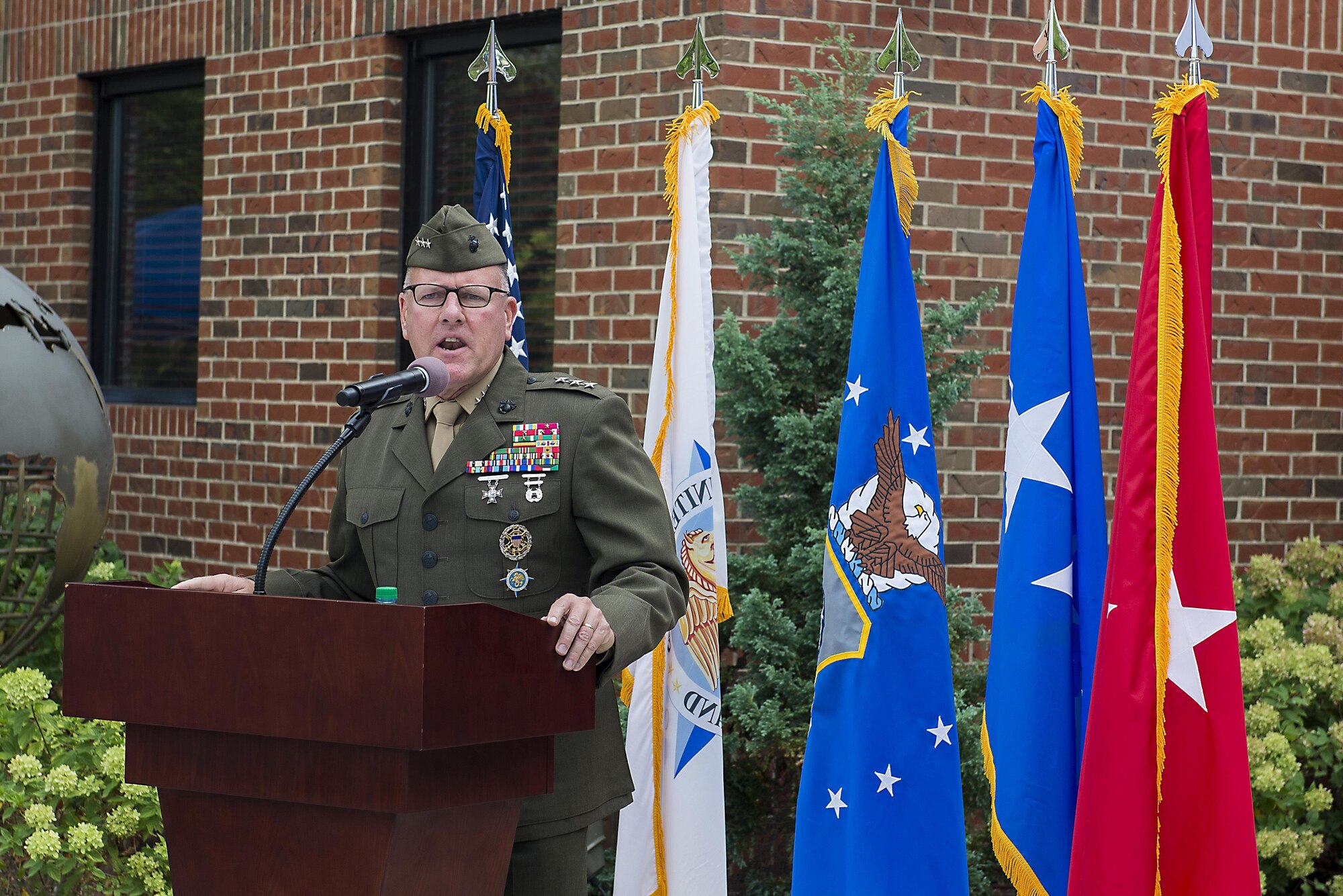 Marine Lt. Gen. John J. Broadmeadow, U.S. Transportation Command deputy commander, discusses Gen. Duane H. Cassidy’s impact of USTRANSCOM during a dedication ceremony renaming the Global Reach and Planning Center to the Gen. Duane H. Cassidy Conference Center, at Scott Air Force Base, Ill., Oct. 6, 2017.