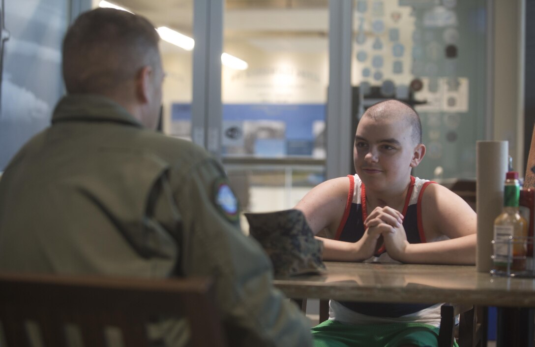 Maddox Hyde meets with Lt. Col. Mark Angersbach, the commanding officer of Marine Corps Air Station (MCAS) Kaneohe Bay, at the Flying Leatherneck during a tour of Marine Corps Base Hawaii, (MCBH) Sept. 27, 2017. The Hyde family was led on tours of MCAS Kaneohe Bay, Aircraft Rescue and Firefighting, and took part in various simulators across MCBH as part of Maddox’s wish to see where his father served before he begins his next cycle of cancer treatment. (U.S. Marine Corps photo by Lance Cpl. Luke Kuennen)