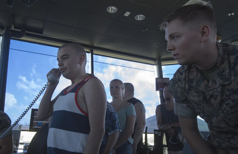 Maddox Hyde directs aircraft traffic from the air traffic control tower during a tour of Marine Corps Base Hawaii, (MCBH) Sept. 27, 2017. The Hyde family was led on tours of Marine Corps Air Station Kaneohe Bay, Aircraft Rescue and Firefighting, and took part in various simulators across MCBH as part of Maddox’s wish to see where his father served before he begins his next cycle of cancer treatment. (U.S. Marine Corps photo by Lance Cpl. Luke Kuennen)