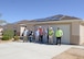 Contractors work to install solar panels on this house in the Tamarisk Plains neighborhood on Edwards Air Force Base. Workers will install solar panels on 368 homes on the base beginning with vacant homes first. (U.S. Air Force photo by Kenji Thuloweit)