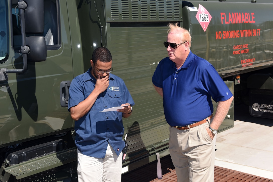 Tracy Taylor, Defense Logistics Agency Energy instructor, trains Jerry Woiton, 30th Logistics Readiness Squadron contractor during a fuel spill exercise, Oct. 6, 2017, at Vandenberg Air Force Base, Calif. DLA Energy provides military installations with the training necessary to prevent and react to disasters, such as this simulated fuel spill, while adhering to federal regulations. (U.S. Air Force photo by Tech. Sgt. Jim Araos/Released)