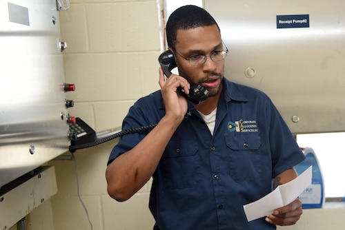 Nelson English, 30th Logistics Readiness Squadron contractor, calls first responders during a fuel spill exercise, Oct. 6, 2017, at Vandenberg Air Force Base, Calif. DLA Energy provides military installations with the training necessary to prevent and react to disasters, such as this simulated fuel spill, while adhering to federal regulations. (U.S. Air Force photo by Tech. Sgt. Jim Araos/Released)