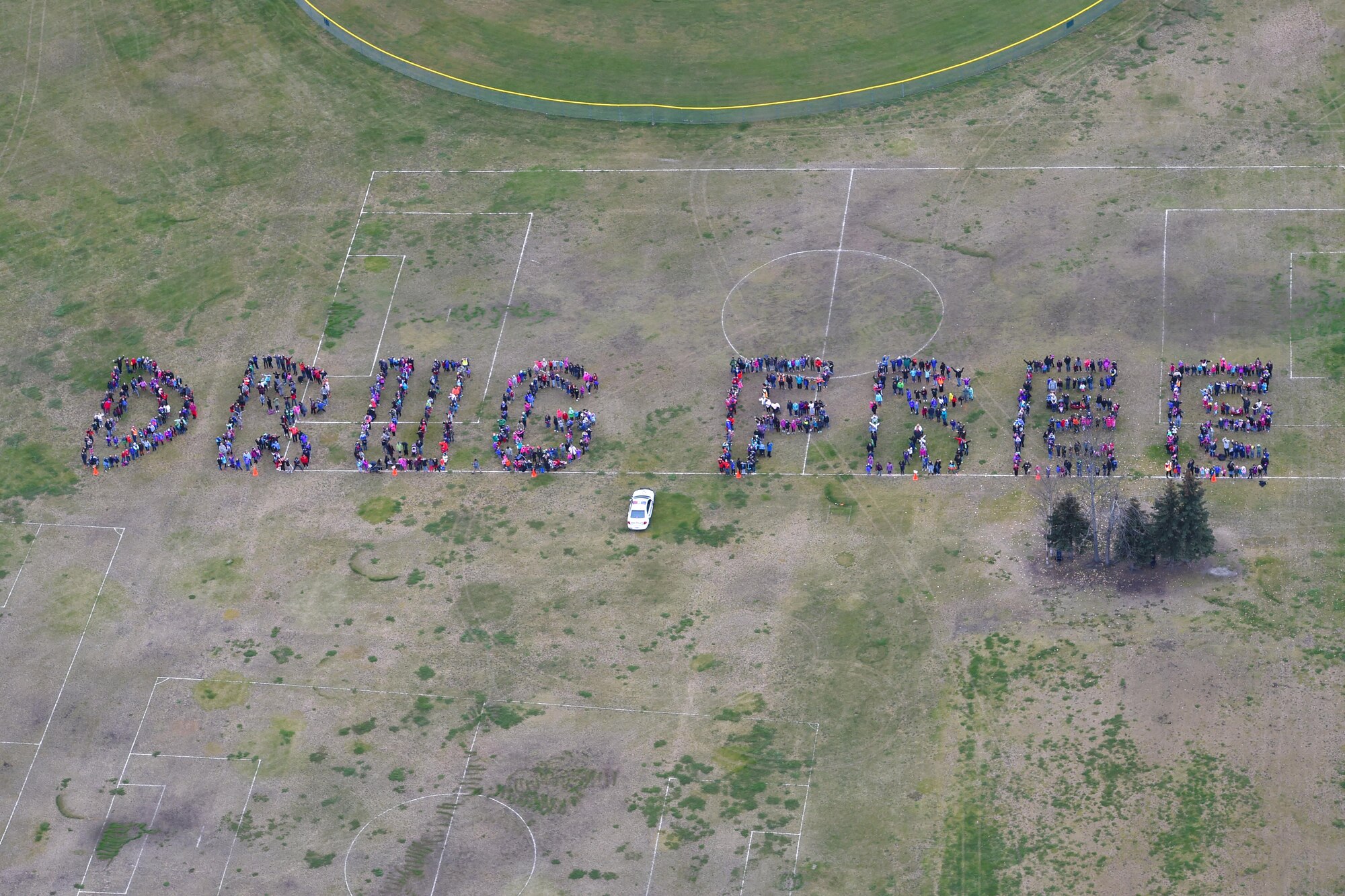 Elementary school children spell out “drug free” in recognition of Red Ribbon Week at Joint Base Elmendorf-Richardson, Alaska, Oct. 10, 2016. Red Ribbon Week is observed nation-wide Oct. 23 to 31 and promotes being drug-free, while honoring the memory of fallen Drug Enforcement Agent Enrique “Kiki” Camarena. (U.S. Air Force photo/Airman 1st Class Javier Alvarez)