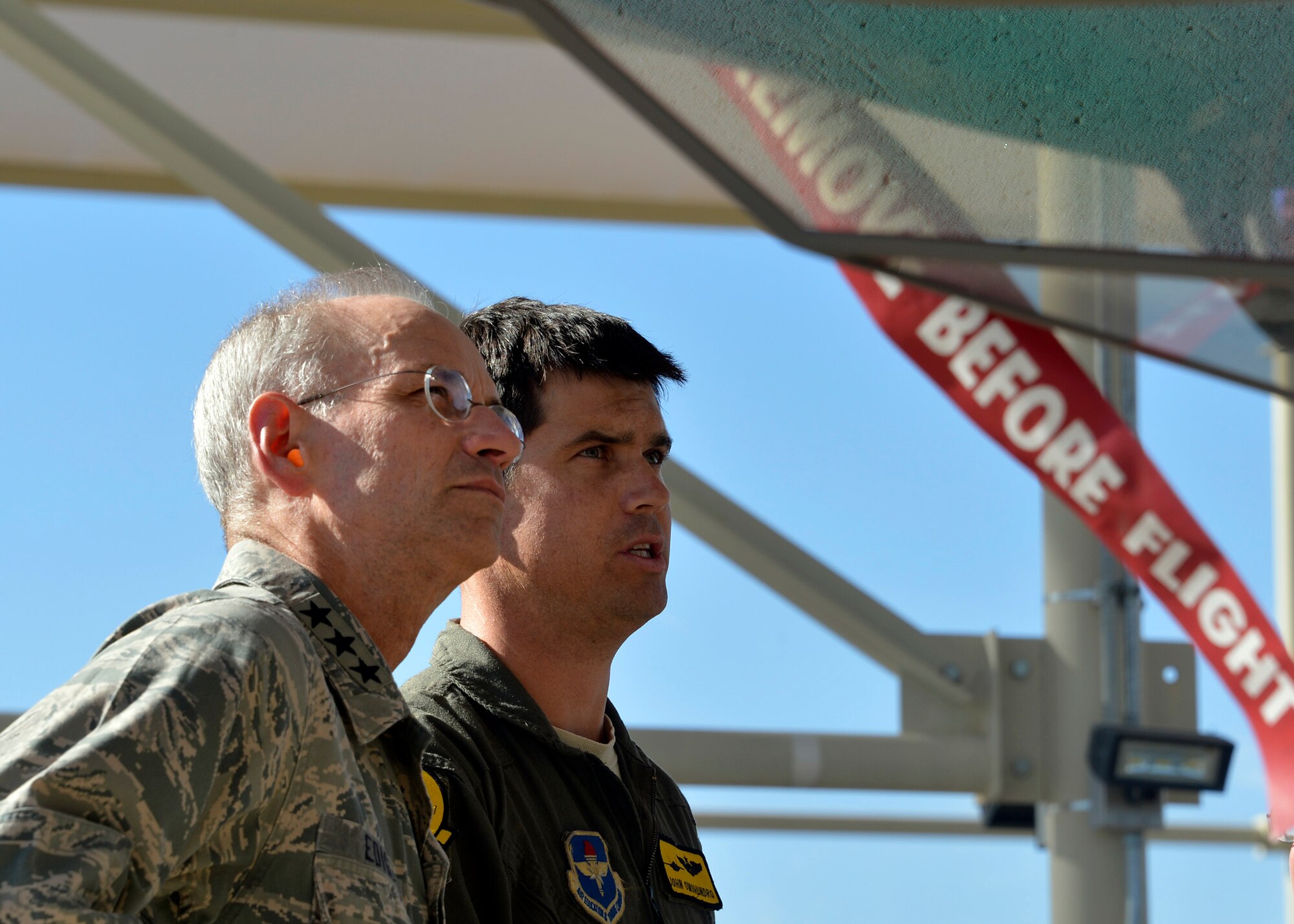 Maj. John Omohundro, 61st Fighter Squadron pilot, shows Lt. Gen. Mark Ediger, Headquarters U.S. Air Force Surgeon General, the F-35A Lightning II during a site visit at Luke Air Force Base, Ariz., Oct. 11, 2017. Ediger visited Luke to see the new renovations to the 56th MDG and how they support the F-35A Lightning II mission. (U.S. Air Force photo by Senior Airman Devante Williams)