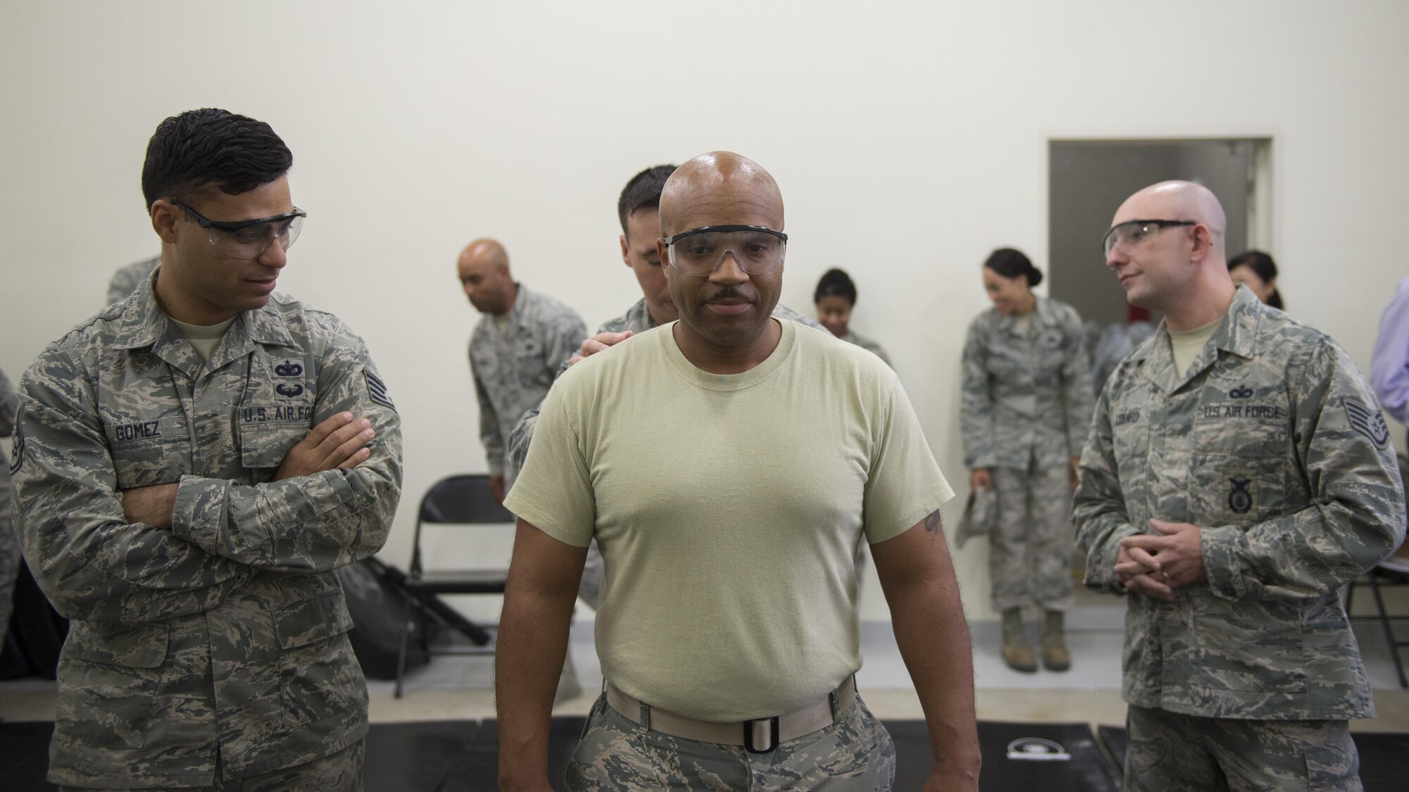 Chief Master Sgt. Elvin Young, 374th Airlift Wing command chief, volunteers to be tased during a 374th Security Forces Squadron less-lethal weapons demonstration, Oct. 11, 2017, at Yokota Air Base, Japan.