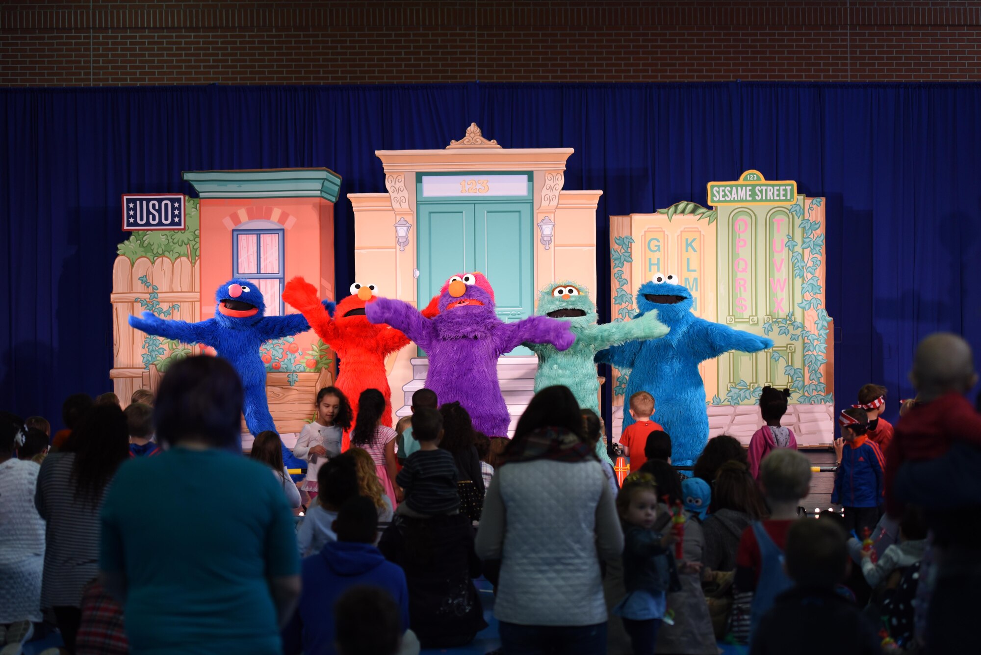 Sesame Street characters sing a song to the audience at the USO’s Sesame Street Tour on Ramstein Air Base Oct. 5, 2017. The show consisted of a medley of songs and dances, teaching military children how to adjust to frequent changes in their lives.