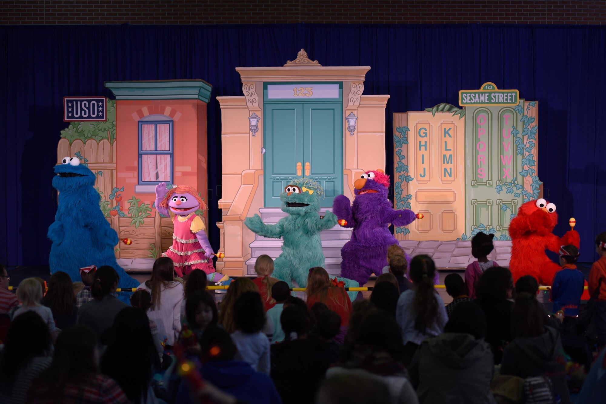 Sesame Street characters dance for an audience at the USO’s Sesame Street Tour on Ramstein Air Base, Oct. 5, 2017. The event was free for all military members and their families.