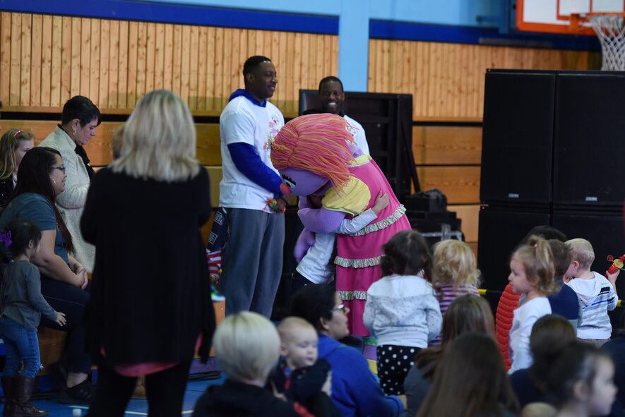 Katie, from Sesame Street, hugs a child in the audience at the USO’s Sesame Street Tour on Ramstein Air Base, Oct. 5, 2017. The characters from the touring show interacted with the audience by greeting every child wanting a hug.