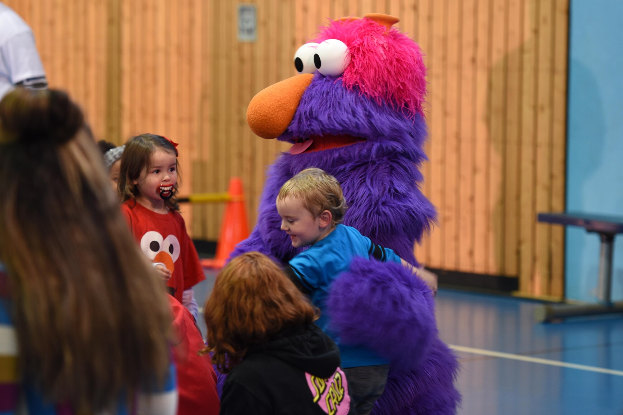 A Sesame Street character hugs a child in the crowd at the USO’s Sesame Street Tour on Ramstein Air Base, Oct. 5, 2017. Following the show, KMC children were able to touch and interact with the characters.