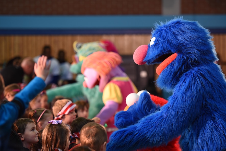 Grover and his friends say farewell to the crowd of KMC children at the USO’s Sesame Street Tour on Ramstein Air Base, Oct. 5, 2017. The theme of the show helped demonstrate resilience skills children can use when facing a move because of because of military life.