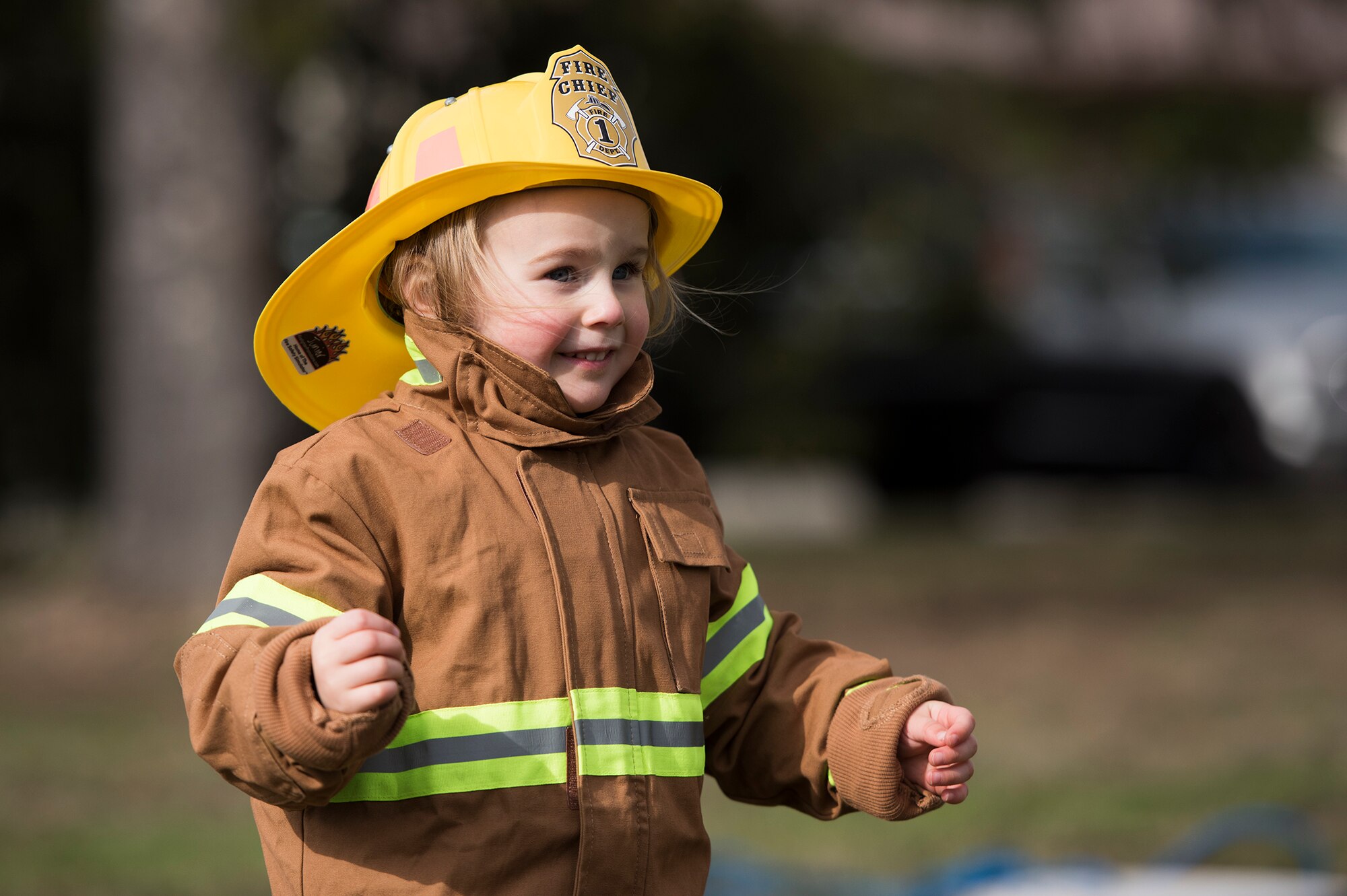 A child from the Kaiserslautern Military Community runs a child fireman’s course during the Fire Prevention Week open house on Ramstein Air Base, Germany, Oct. 7, 2017. The course included a fire hose drag, litter carry and forcible entry challenges. Fire Departments from Ramstein Village, Landstuhl, Carlsberg, and Technical Relief Foundation (THW) Kaiserslautern, participated in the parade and open house. This year’s theme, “Every second counts, plan two ways out!” encourages families to have more than one exit plan in case of an emergency. (U.S. Air Force photo by Airman 1st Class Devin M. Rumbaugh)