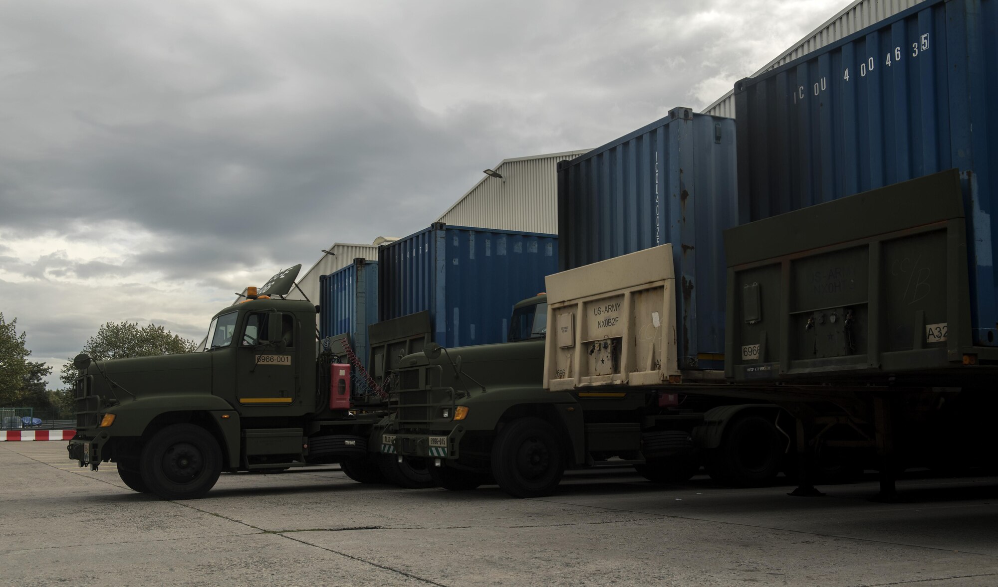 U.S. Army trucks wait to be loaded with mail for servicemembers stationed within the European theater in Frankfurt, Germany, Oct. 5, 2017. The U.S. Air Forces in Europe and Air Forces Africa Air Postal Squadron works alongside the Army to provide air and ground transportation for mail delivered throughout Europe. (U.S. Air Force photo by Senior Airman Tryphena Mayhugh)