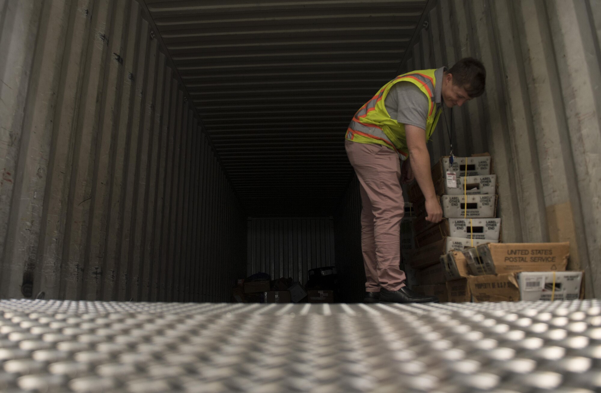 U.S. Air Force Staff Sgt. Patrick Murphy, U.S. Air Forces in Europe and Air Forces Africa Air Postal Squadron mail control postal specialist, inspects mail loaded onto a truck to ensure it is going to the right location in Frankfurt, Germany, Oct. 5, 2017. The USAFE AFAFRICA AIRPS has detachments in Frankfurt; London, England; and Istanbul, Turkey to oversee the offloading, inspecting, sorting, and loading onto trucks the mail undergoes. (U.S. Air Force photo by Senior Airman Tryphena Mayhugh)