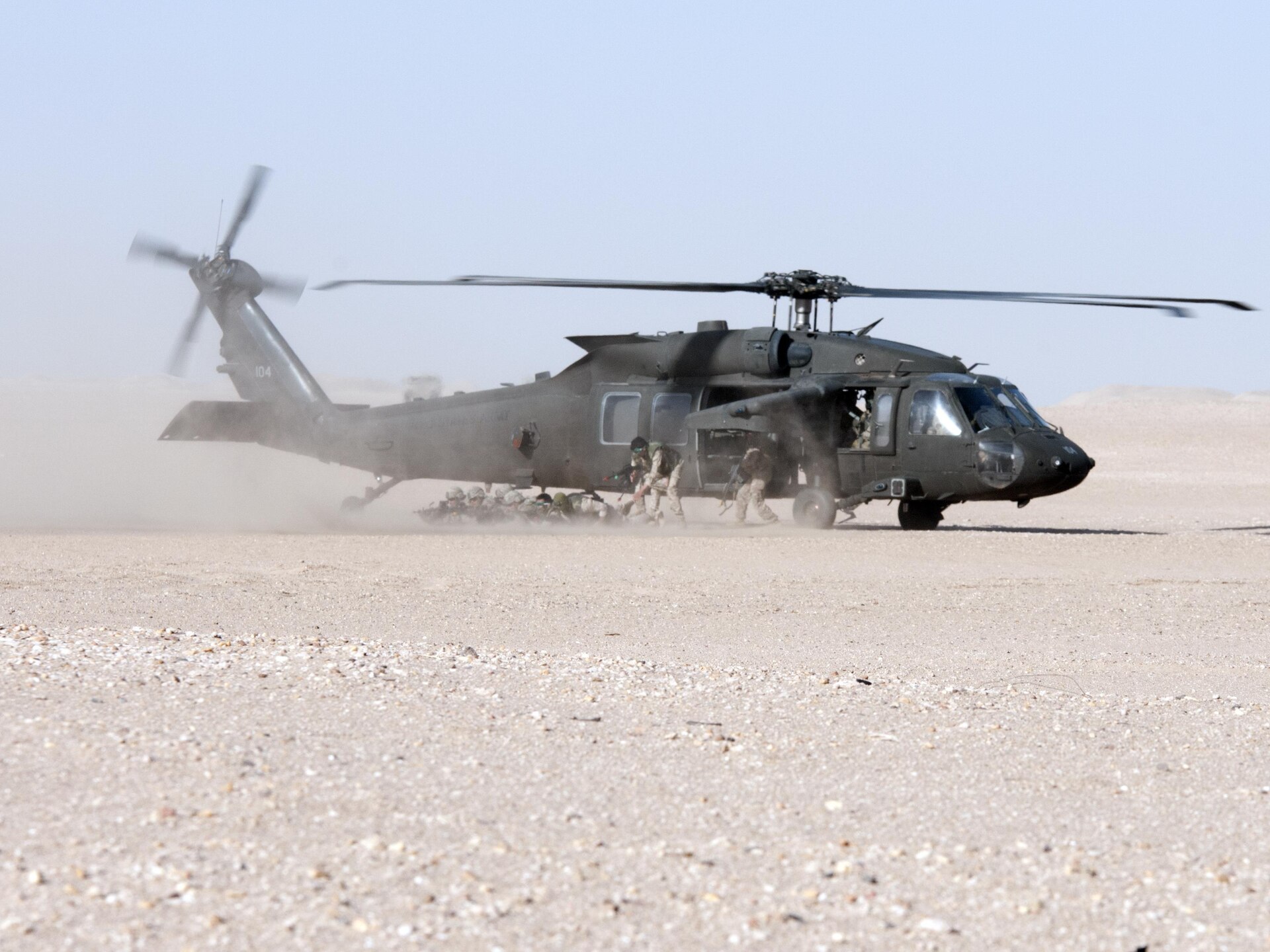 Black Hawk helicopter in the desert.