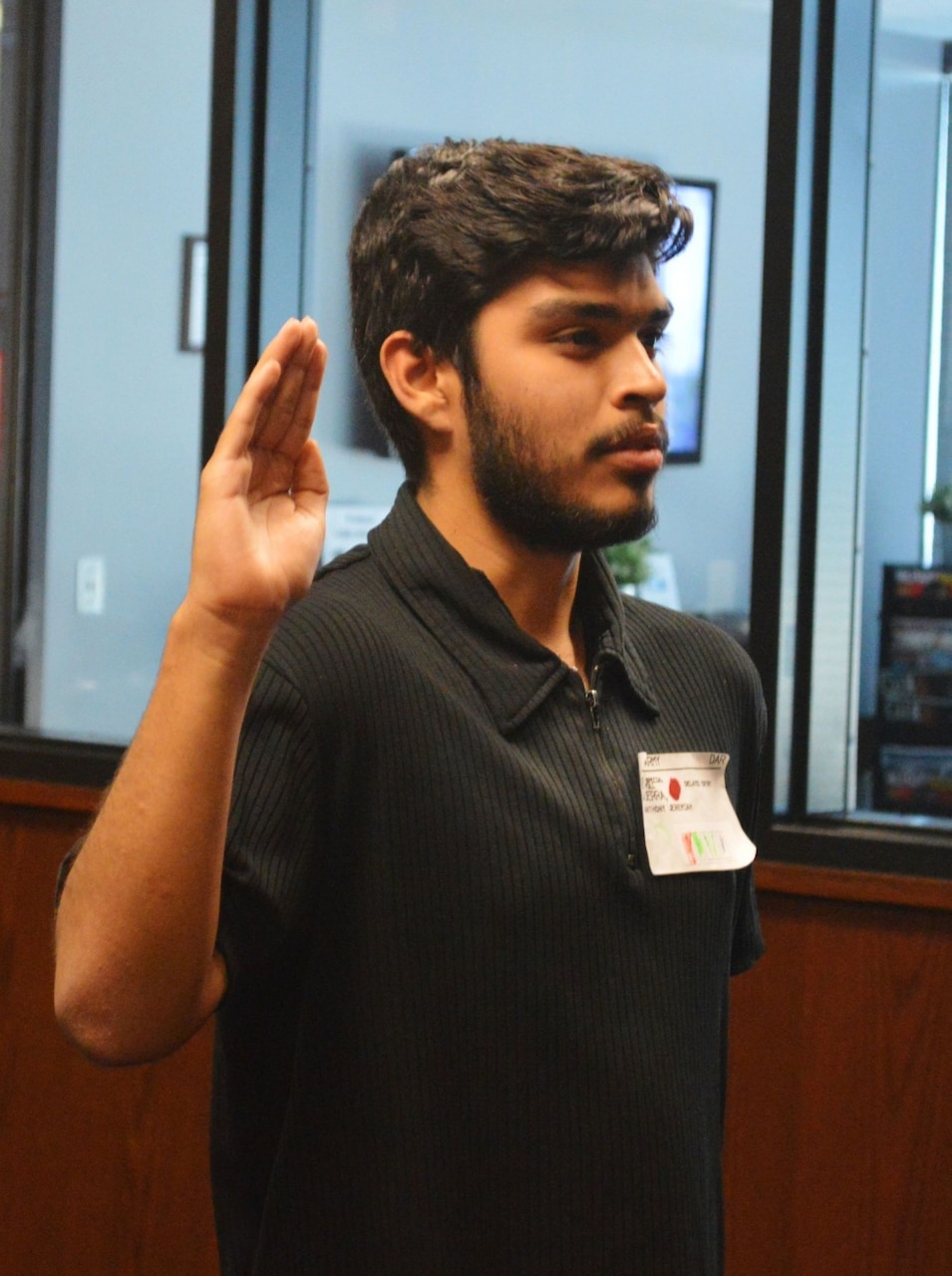 Anthony Guerra, 17, performs the Army oath of enlistment at Phoenix Military Entrance Processing Station, Sept. 21, 2017. Present for the ceremony was his family, including his brother Joshua, his mother Mayra, and his father, Army Sgt. 1st Class Jaime Guerra. Army photo by Alun Thomas