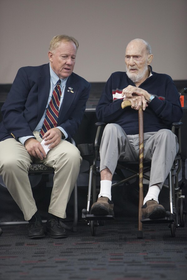 Erick Simmel, left, Office of Strategic Services Maritime Unit descendant and historical expert on World War II special operations forces, presents a lecture alongside the last living frogman from the Office of Strategic Services Maritime Unit, Henry Weldon, on Camp Pendleton, Calif., Sept. 29, 2017.  The lecture was given to Marines from 1st Marine Raider Support Battalion, U.S. Marine Corps Forces, Special Operations Command, in order to reinforce the historical wartime legacy of the Marine Raiders in World War II.   (U.S. Marine Corps photo by Cpl. Bryann K. Whitley)