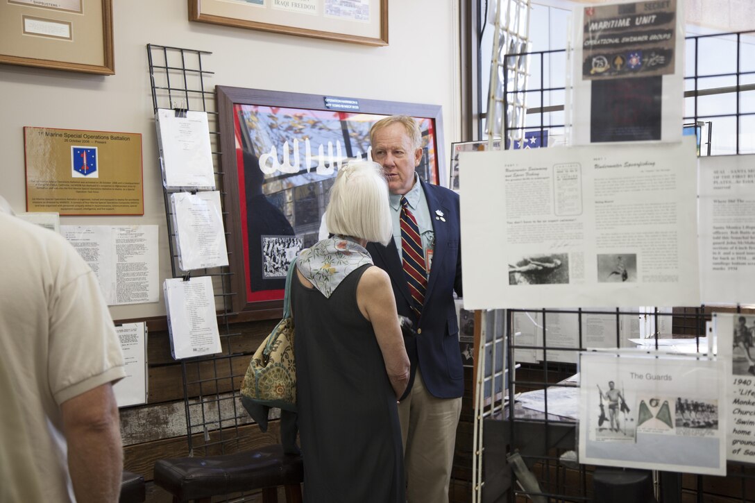 Erick Simmel, a descendant of an Office of Strategic Services Maritime Unit combat swimmers and an expert on World War II special operations forces, talks with an attendee at a lecture given on Camp Pendleton, Calif., Sept. 29, 2017. Simmel educated Marines and Sailors from 1st Marine Raider Support Battalion on the history of the OSS combat swimmers, also known as frogmen. These early special operators endured a demanding training pipeline under the tutelage of Marine Raiders. The lecture was one example of Marine Raiders of today honoring the historical legacy forged by their World War II forebears.   (U.S. Marine Corps photo by Cpl. Bryann K. Whitley)