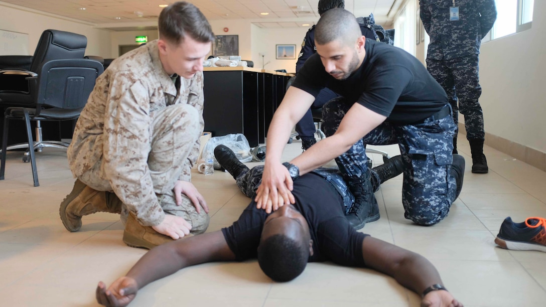 Members of the Kuwaiti Ministry of Interior Explosive Ordnance Team provide first responder care and a primary exam to a simulated casualty during the final trauma exercise during a medical exchange with the Kuwaiti Ministry of Interior explosive ordnance team in Kuwait. The 15th MEU is deployed with the America Amphibious Ready Group in order to maintain regional security in the U.S. 5th Fleet area of operations.