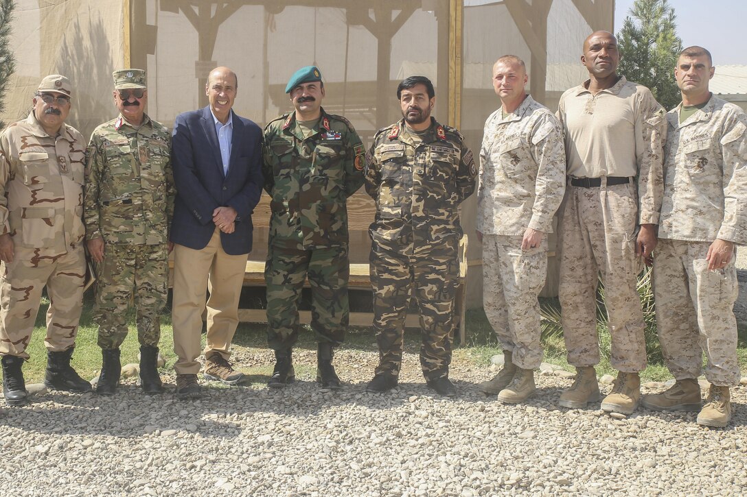 Ambassador Hugo Llorens, third from left, the Special Chargé d’Affaires of the U.S. Embassy in Kabul, U.S. Marines with Task Force Southwest and Afghan National Defense and Security Force leadership pose for a photo at Camp Shorab, Afghanistan, Oct. 12, 2017. During his visit, Llorens had an opportunity to discuss mission progress with key Task Force Southwest and ANDSF leaders, while reaffirming the United States’ commitment to thwarting the Taliban in Helmand province. (U.S. Marine Corps photo by Sgt. Lucas Hopkins)