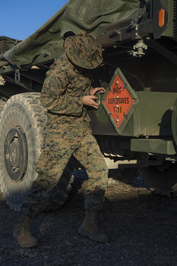 Cpl. Joshua Hodges, an artillery cannonneer with 3rd Platoon, Rocket Battery F, 2nd Battalion, 14th Marine Regiment, Marine Forces Reserve, opens a supply box during Weapons and Tactics Instructor course 1-18 at Landing Zone Bull Attack near the Chocolate Mountain Aerial Gunnery Range, California, Oct. 6- 19, 2017. The Marines participated in WTI 1-18 during their two-week annual training and using the HIMARS to fire Guided Multiple Launch Rocket System rockets in a ‘sensor to shooter integration’ exercise with Marine Fighter Attack Squadron 121, 3rd Marine Aircraft Wing, flying the F-35B Lightning II Joint Strike Fighter. (U.S. Marine Corps photo by Lance Cpl. Melany Vasquez/ Released)