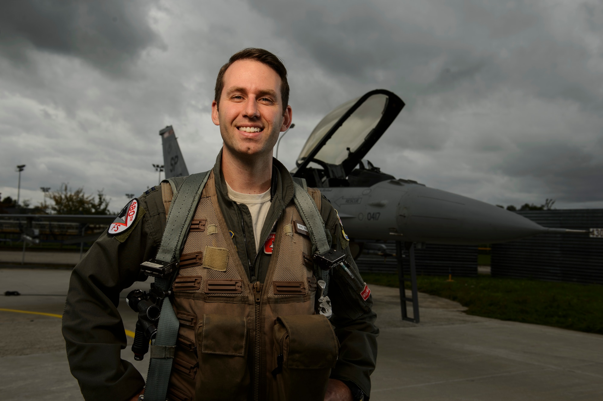 Capt. Tyler Brummer, 480th Fighter Squadron F-16 Pilot, stands next to an F-16 Fighting Falcon, Oct. 3rd, 2017. Capt. Brummer is the 2017 USAFE Fighter Aviator of the Year.