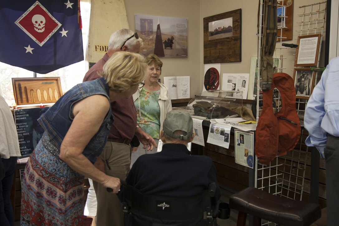 The Marines and Sailors of 1st Marine Raider Support Battalion view historical displays and artifacts following a lecture, Sept. 29, 2017 on Camp Pendleton, Calif., on the Office of Strategic Services Maritime Unit, an early special operations force created during World War II. The special guest at the lecture was Henry Weldon, the last living OSS frogman. The frogmen underwent a rigorous training pipeline led by Marine Raiders. The event was held in order to sustain the Marines’ understanding and appreciation for the legacy forged by the Raiders of World War II.   (U.S. Marine Corps photo by Cpl. Bryann K. Whitley)