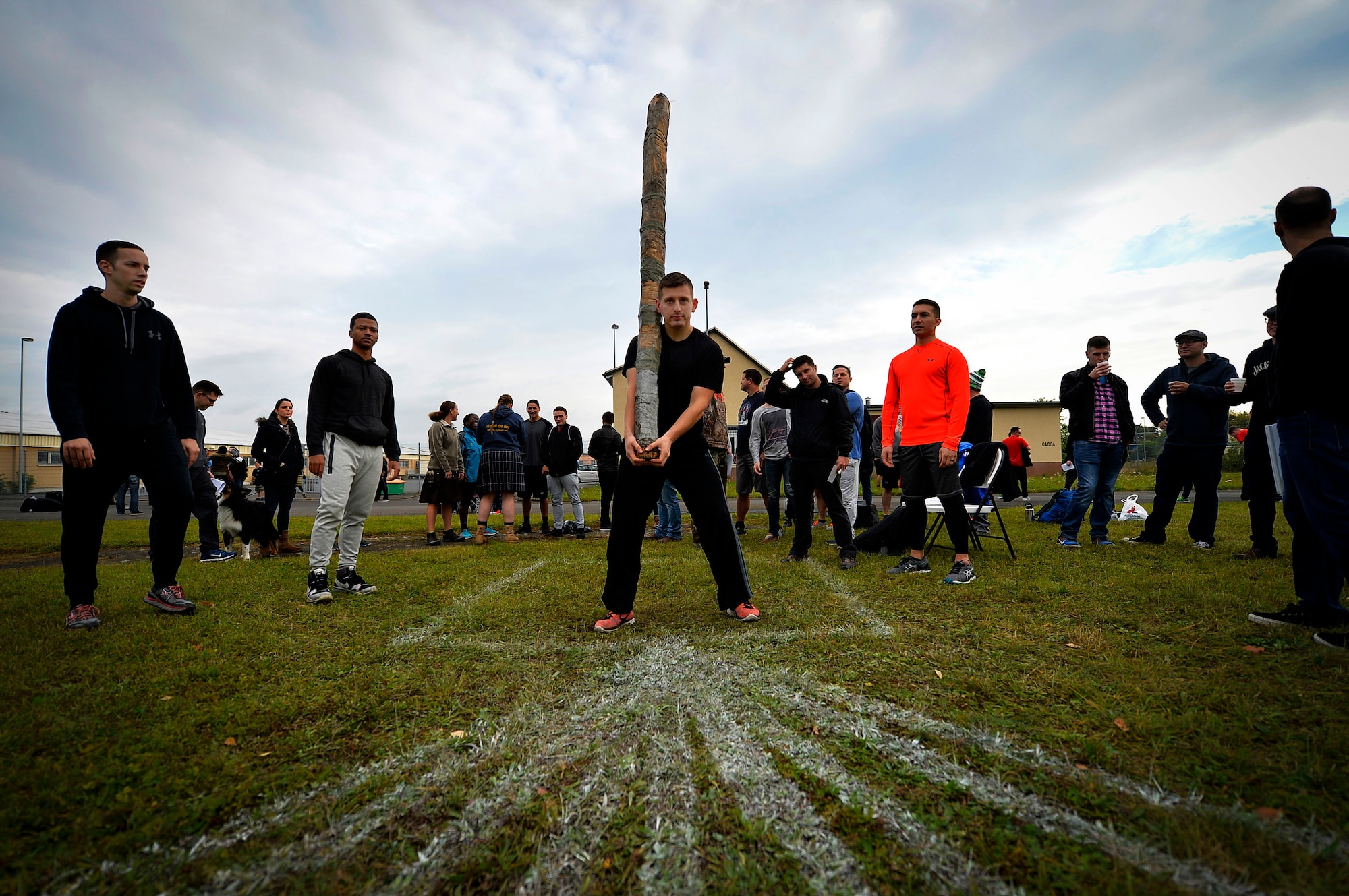 U.S. Air Force Capt. Jose Machuca, 450th Intelligence Squadron intelligence officer, participates in a log toss event during the 693rd Intelligence, Surveillance, and Reconnaissance Group’s Highland Games at Wiesbaden, Germany, Oct. 11, 2017. The games featured nine sporting events and were attended by more than 200 people. (U.S. Air Force photo by Airman 1st Class Joshua Magbanua)