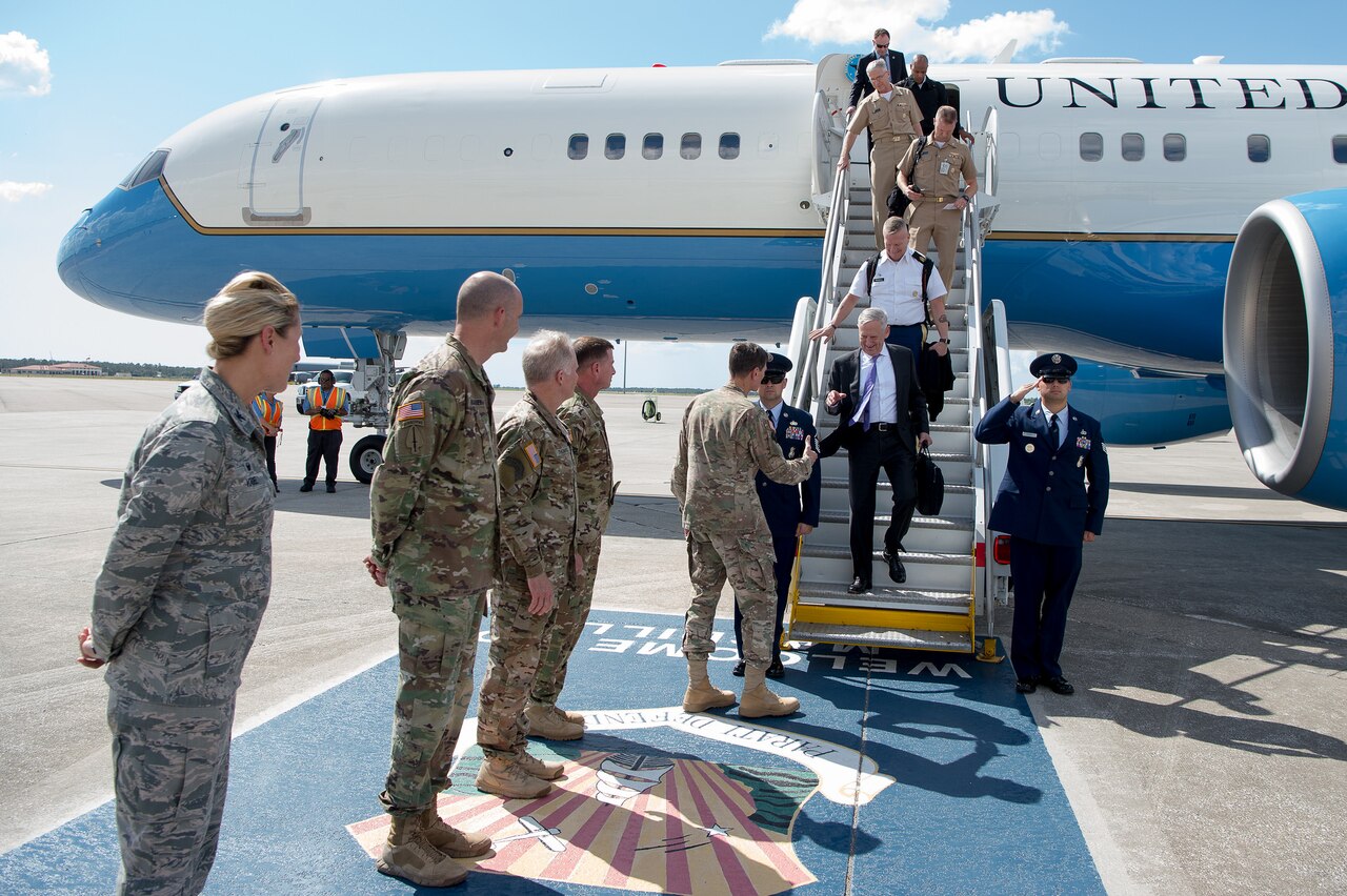 Defense Secretary Jim Mattis and the senior enlisted advisor to the chairman of the Joint Chiefs of Staff, Army Command Sgt. Maj. John Troxell, arrive at MacDill Air Force Base in Tampa, Fla.