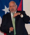 IMAGE: DAHLGREN, Va. (Sept. 28, 2017) - Hispanic Heritage Observance keynote speaker Lance Carrington encourages his audience to pray for the residents of Puerto Rico after Hurricane Maria devastated the island, and to pray for those living in Texas, the Gulf Coast, and Florida who are recovering from Hurricanes Harvey and Irma. Carrington – retired from the Senior Executive Service (SES) as a special agent for NASA and the U.S. Postal Service – recounted his life and career which included service in the Army as a reserve chief warrant officer. He retired from the Army reserves on Oct. 1, 2017 after more than 35 years of active duty, National Guard, and reserve service. He is currently executive director of the Catholic Diocese of Arlington’s Guadalupe Free Clinic in Colonial Beach, Va. The clinic serves the indigent and medically-uninsured population in Westmoreland County and Colonial Beach, on the Northern Neck of Virginia.
