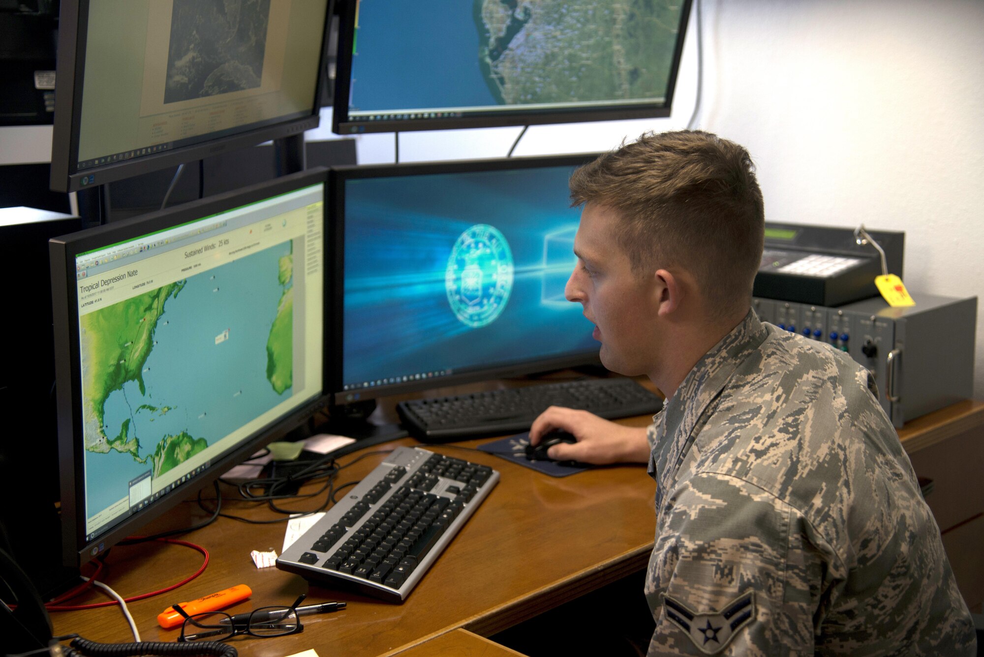 U.S. Air Force Airman 1st Class Ethan Sheptow, a weather forecaster assigned to the 6th Operations Support Squadron, demonstrates how the Hurrtrak program works at MacDill Air Force Base, Fla., Oct. 10, 2017.