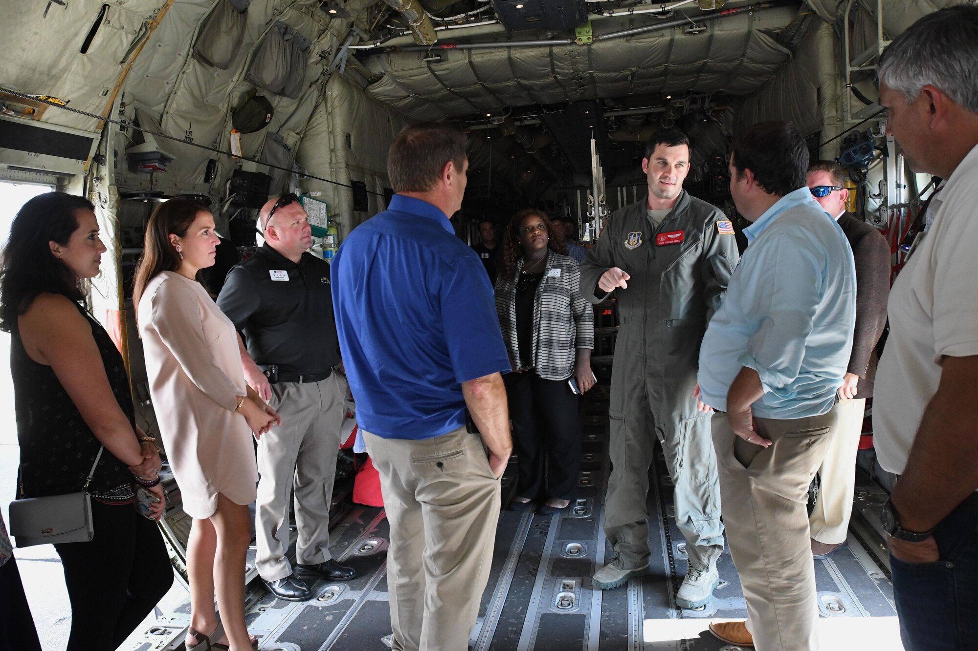 Tech. Sgt. Taylor Noel, 815th Airlift Squadron loadmaster, provides a briefing of C-130 Super Hercules aircraft mission capabilities during the Mississippi Gulf Coast Chamber Leadership Gulf Coast tour Oct. 11, 2017, on Keesler Air Force Base, Mississippi. The program is designed to prepare the areas current and potential leaders for the future with the goal to create a communication network between present and emerging leaders dedicated to the improvement of the Mississippi Gulf Coast by attending a monthly session focused on industry. (U.S. Air Force photo by Kemberly Groue)