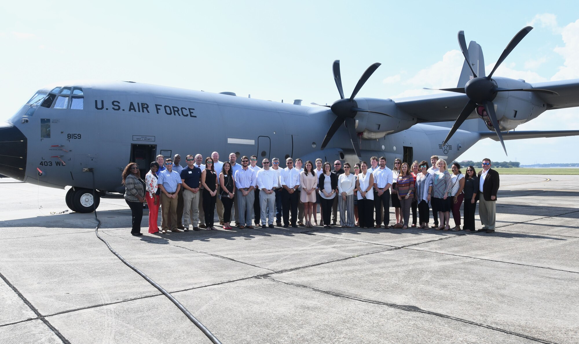 Members of the Mississippi Gulf Coast Chamber Leadership Gulf Coast pose for a group photo in front of a C-130 Super Hercules aircraft during a tour Oct. 11, 2017, on Keesler Air Force Base, Mississippi. The program is designed to prepare the areas current and potential leaders for the future with the goal to create a communication network between present and emerging leaders dedicated to the improvement of the Mississippi Gulf Coast by attending a monthly session focused on industry. (U.S. Air Force photo by Kemberly Groue)