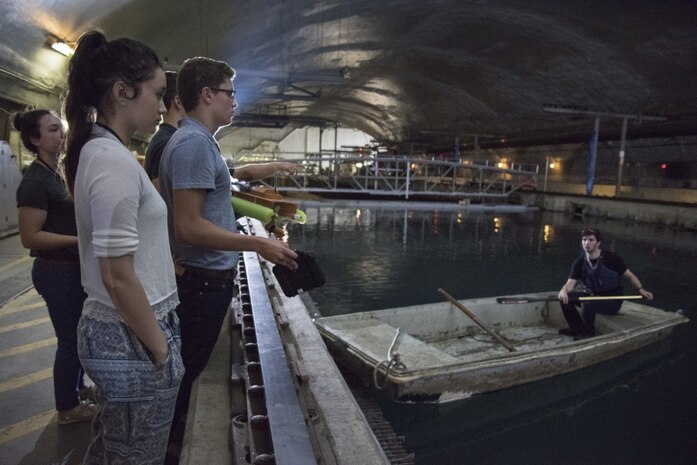 A 3-D printed boat created by student interns currently assigned to Naval Surface Warfare Center, Carderock Division under the Science and Engineering Apprenticeship Program, navigates an obstacle course in the David Taylor Model Basin during the Additive Manufacturing (AM) Challenge in West Bethesda, Md., Aug. 10, 2017. These students designed and created additively manufactured boats using a standard kit of parts and raced them in the basin to complete the event, which is sponsored by the Naval Sea Systems Command 05 Chief Technology Office. (U.S. Navy photo by Dustin Q. Diaz/Released)