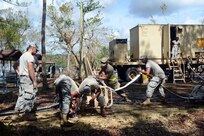 Army Reserve soldiers setup a water pump to begin water purification from Guajataca Lake in Quebradillas.