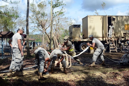 Army Reserve soldiers setup a water pump to begin water purification from Guajataca Lake in Quebradillas.