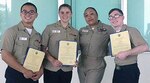 (From left) Petty Officer 2nd Class Johnny Le, Petty Officer 3rd Class  Candice Smith, Chief Petty Officer Jane Nonthaveth, and Petty Officer 3rd Class  Royal Miller following the meritorious promotion ceremony concluded June 30 at U.S. Naval Hospital Okinawa, Japan.