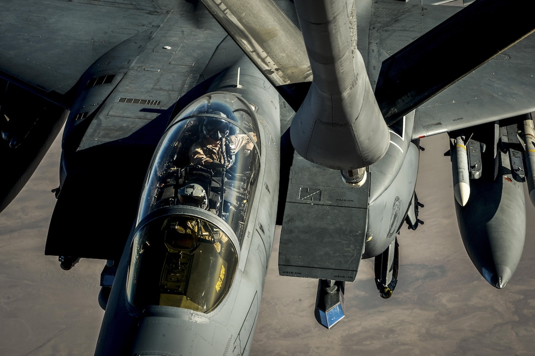 An aircraft prepares to receive fuel from another aircraft in flight.