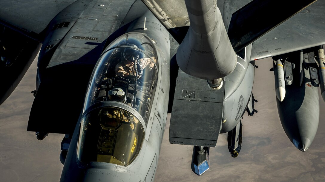 An aircraft prepares to receive fuel from another aircraft in flight.