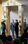 Soldiers participate in a non-commissioned officer induction ceremony Oct. 4 at Brooke Army Medical Center.  Twenty-seven Soldiers recited the NCO charge led by BAMC Command Sgt. Maj. Diamond Hough before walking through the NCO arch.