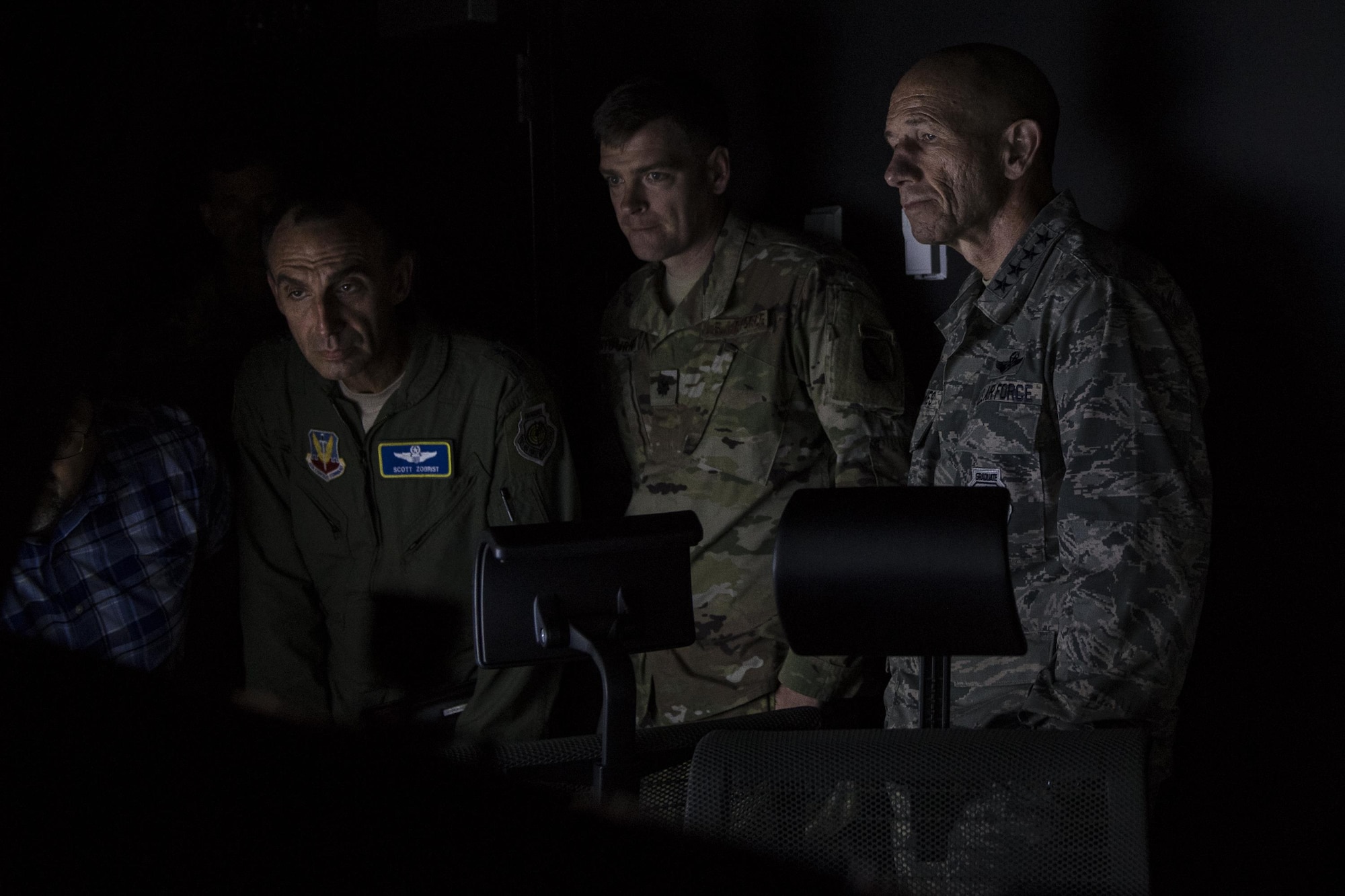 Gen. Mike Holmes, commander of Air Combat Command, far right, Lt. Col. Richard Fournier, 20th Air Operations Support Squadron commander, center, and Maj. Gen. Scott J. Zobrist, 9th Air Force commander, view joint terminal attack controller training equipment during Holmes’ visit to the 20th ASOS, Oct. 9, 2017, at Fort Drum, N.Y. Holmes visited Airmen belonging to the 14th, 20th and 682d ASOS, and 18th Weather Squadron Detachment 1 during Warfighters Exercise 18-1, to observe Airmen fully engaged in roles they would fill for the Army while downrange. (U.S. Air Force photo by Senior Airman Janiqua P. Robinson)