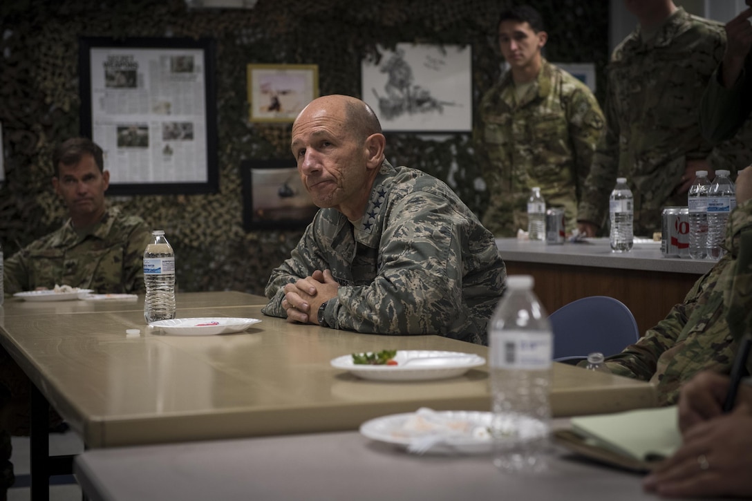 Gen. Mike Holmes, commander of Air Combat Command, center, listens to questions over lunch during his visit to the 20th Air Support Operations Squadron, Oct. 9, 2017, at Fort Drum, N.Y. Holmes visited Airmen belonging to the 14th, 20th and 682d ASOS, and 18th Weather Squadron Detachment 1 during Warfighters Exercise 18-1, to observe Airmen fully engaged in roles they would fill for the Army while downrange. (U.S. Air Force photo by Senior Airman Janiqua P. Robinson)