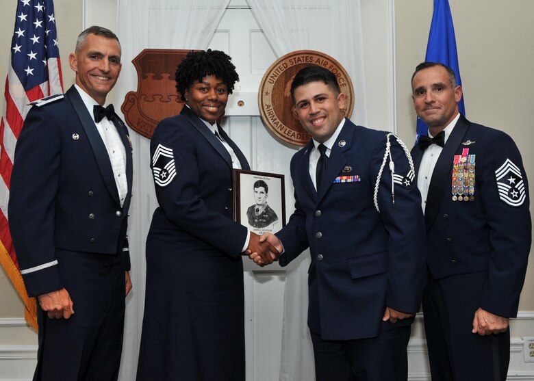 U.S. Air Force Senior Airman Daniel Aviles, 3rd Intelligence Squadron, receives the John L. Levitow Award for class 17-7 of the Senior Master Sgt. David B. Reid Airman Leadership School from Chief Master Sgt. Lisa Rogers, the class’ senior advisor, at Shaw Air Force Base, S.C., Oct. 6, 2017.