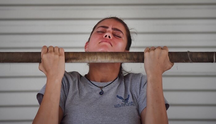 Jessica Ingwerson, Fort Dorchester High School Air ForceJunior Reserve Officer Training Corps member, does pull ups at a U.S. Marine Corps recruiting station during Joint Base Charleston’s annual Career Day here Oct. 11, in South Carolina. Junior ROTC units attended Career Day to get a closer look at what it's like to serve in the U.S. Military. Career Day is a way for the base to connect with young, and possible future service members in the community. Approximately 250 Junior ROTC cadets had the opportunity to have a face-to-face interaction with service members representing the U.S. Army, U.S. Marine Corps, U.S. Navy, U.S. Air Force and U.S. Coast Guard. (U.S. Air Force photo by Staff Sgt. Christopher Hubenthal)
