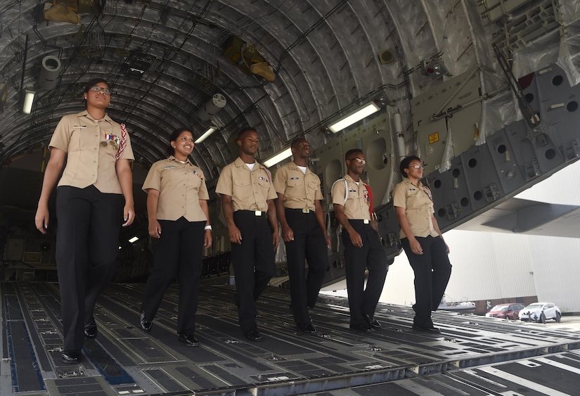 Navy Junior Reserve Officer Training Corps members from Jenkins High School, Savannah, Georgia, walk off of a C-17 Globemaster III during Joint Base Charleston’s annual Career Day here Oct. 11, in South Carolina. ROTC units attended Career Day to get a closer look at what it's like to serve in the U.S. Military. Career Day is a way for the base to connect with young, and possible future service members in the community. Approximately 250 Junior ROTC cadets had the opportunity to have a face-to-face interaction with service members representing the U.S. Army, U.S. Marine Corps, U.S. Navy, U.S. Air Force and U.S. Coast Guard.