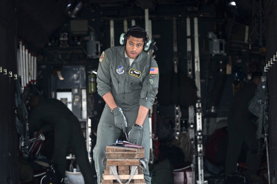 Senior Airman Gary Coe, 36th Airlift Squadron C-130H loadmaster, performs a pre-flight inspection on a C-130H Hercules, at Yokota Air Base, Japan, Oct. 5, 2017. This is the last active duty C-130H Hercules tactical training sortie.