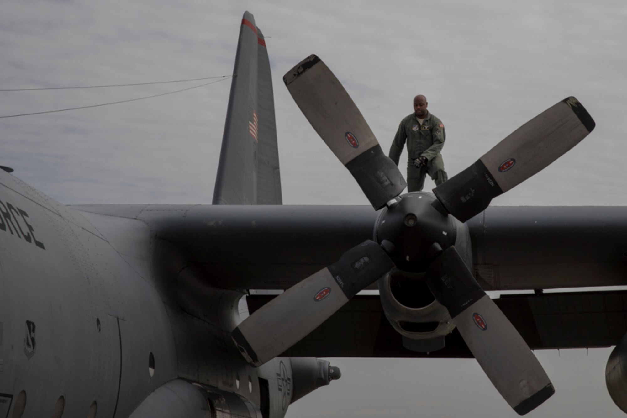 Tech. Sgt. Joshua Pittman, 36th Airlift Squadron C-130H flight engineer, inspects the left outboard motor bay of a C-130H Hercules, at Yokota Air Base, Japan, Oct. 5, 2017. This is the last active duty C-130H Hercules tactical training sortie.